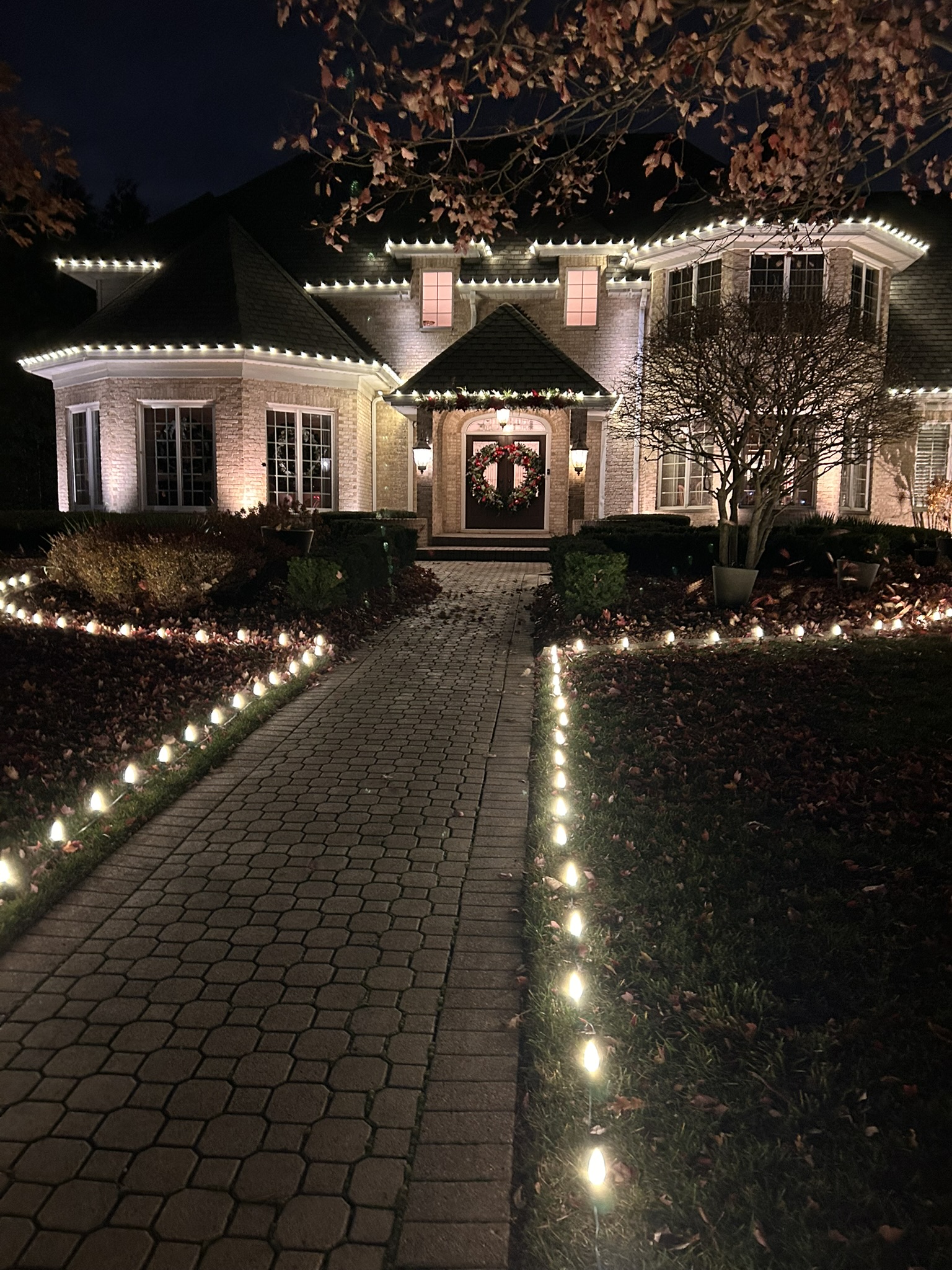 Walkway holiday lighting by Twinkle Bros